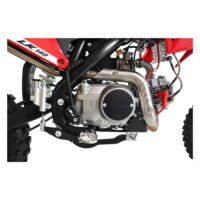 The 10TEN JHL LK140 140cc dirt bike showing the heavy duty drive chain assembly black alloy rims and tall motocross seat height